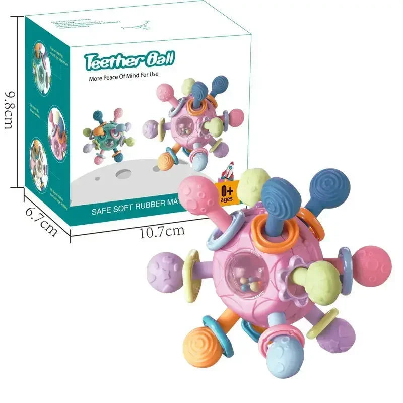 Pink silicone spinning rattle teether ball with colorful sensory arms and a clear center, shown with its product box.