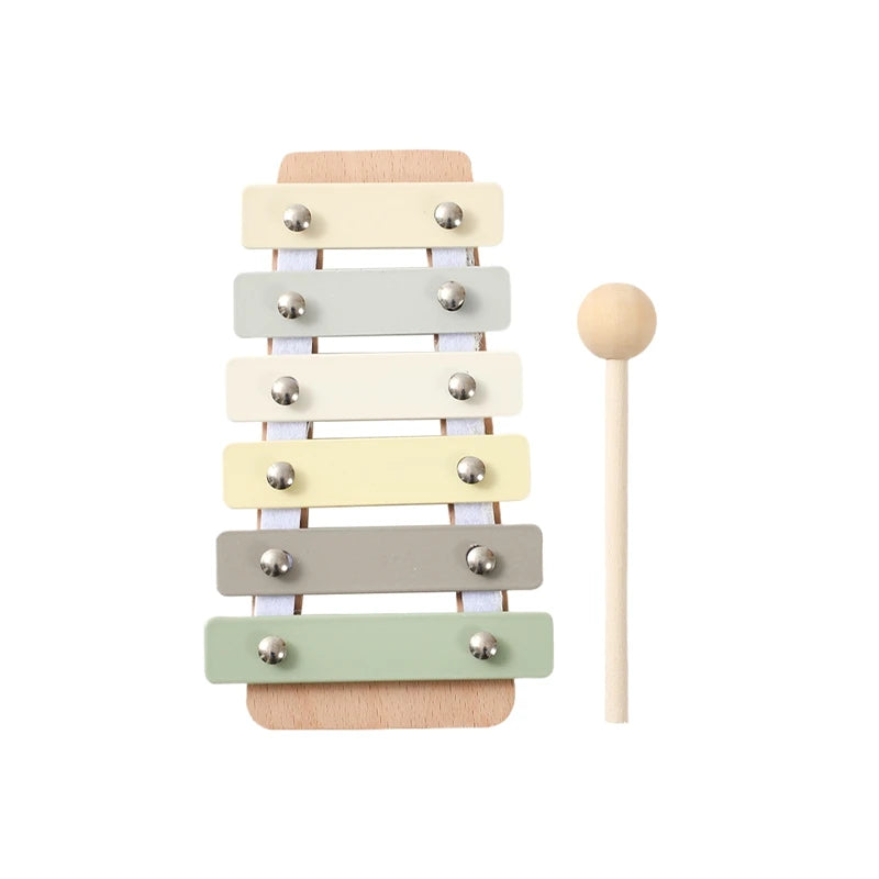 Wooden Montessori xylophone for babies and toddlers with pastel-colored keys and a natural wood mallet.