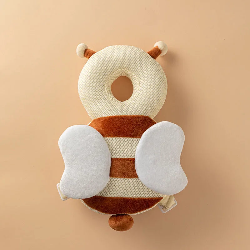Breathable bee-shaped baby head protection pillow with brown and white stripes, mesh, and soft wings.