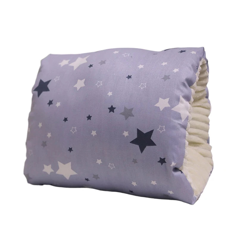 Lavender nursing pillow with white, gray, and dark blue star pattern, soft cream interior.