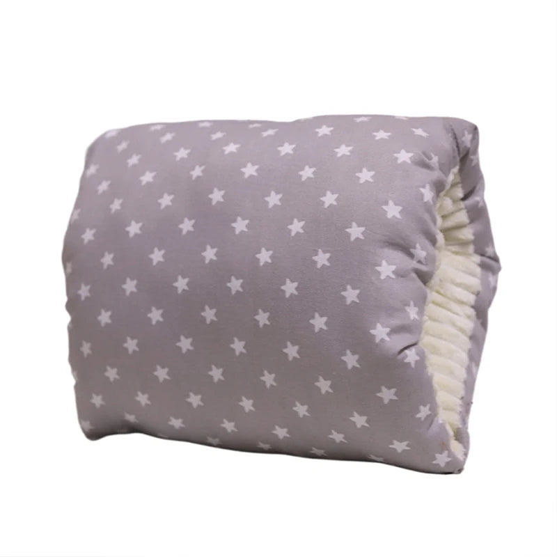 Gray cotton nursing pillow with white stars and soft cream lining.