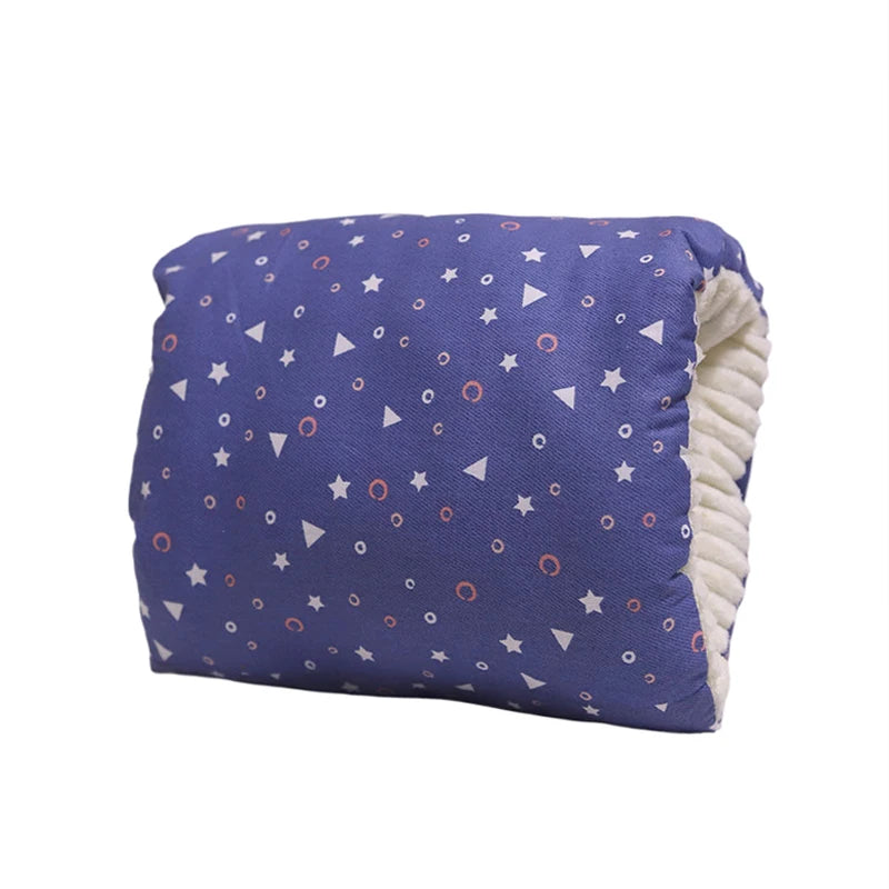 Blue cotton nursing pillow with white, orange, and blue star and circle pattern, soft cream interior.