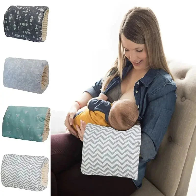 Woman breastfeeding baby using a gray chevron nursing pillow, with three other patterned pillows shown.