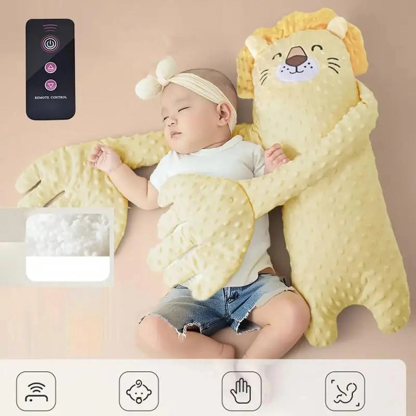 Baby sleeping with a yellow lion-shaped electric soothing pillow and remote control.