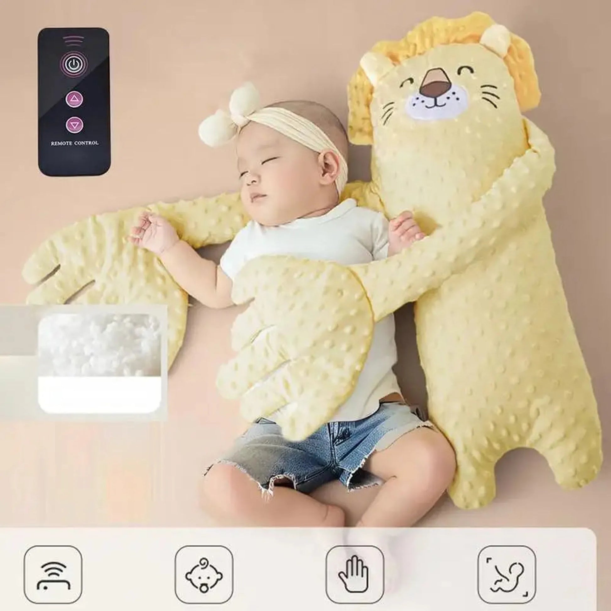 Baby sleeping with a yellow lion-shaped electric soothing pillow and remote control.