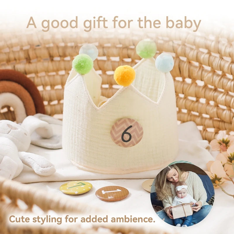 Cream cotton baby birthday crown with colorful pom-poms and a removable "6" age marker.