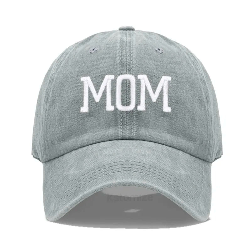 Adjustable gray cotton baseball cap with "MOM" embroidered in white.