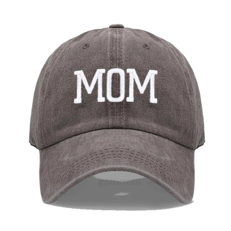 Adjustable gray cotton baseball cap with "MOM" embroidered in white.