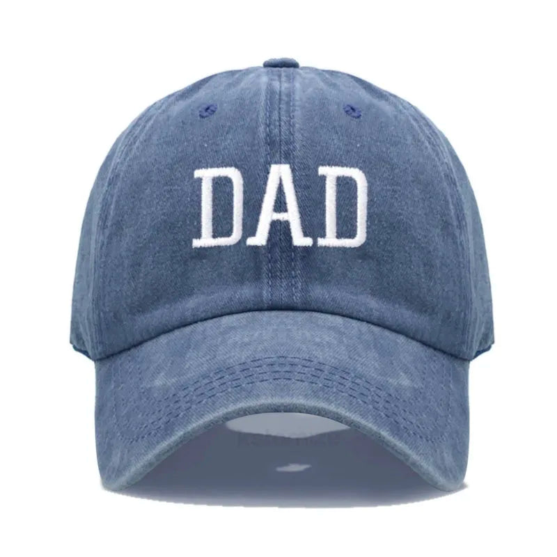 Adjustable navy blue washed cotton baseball cap with "DAD" embroidered in white.