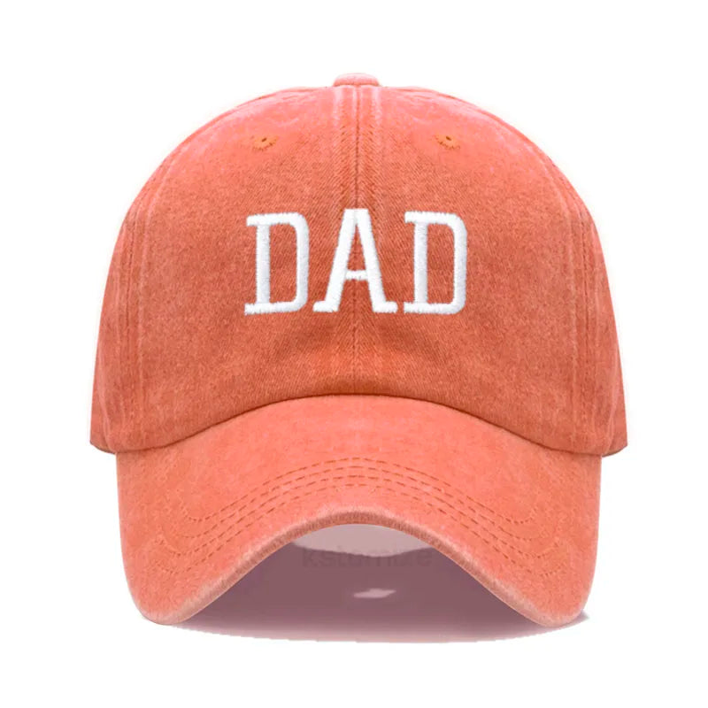 Adjustable orange cotton baseball cap with "DAD" embroidered in white.
