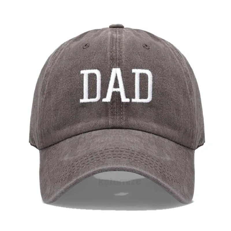 Adjustable gray cotton baseball cap with "DAD" embroidered in white.