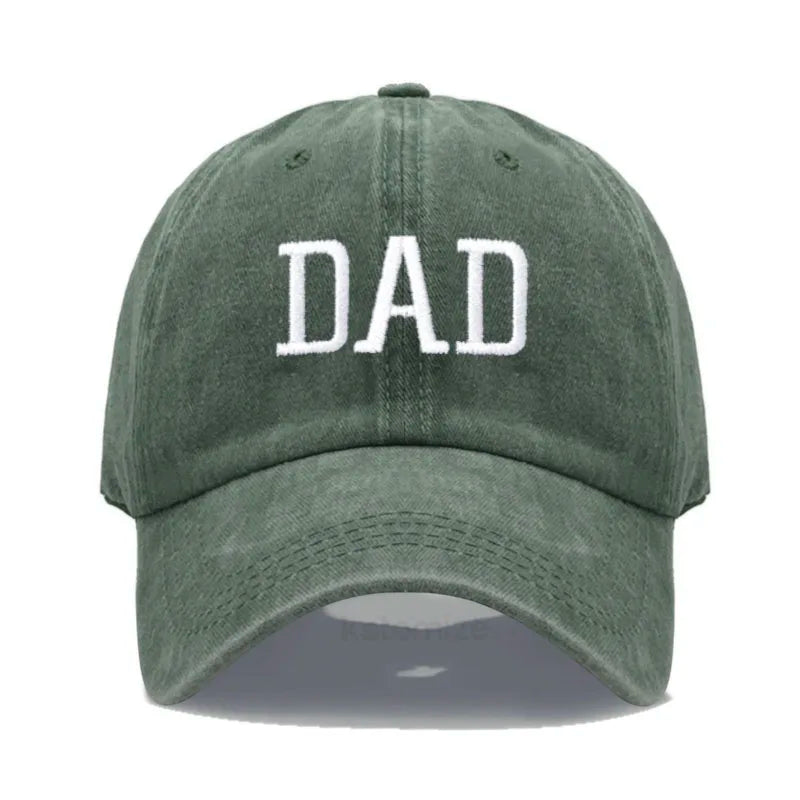 Adjustable olive green cotton baseball cap with "DAD" embroidered in white.