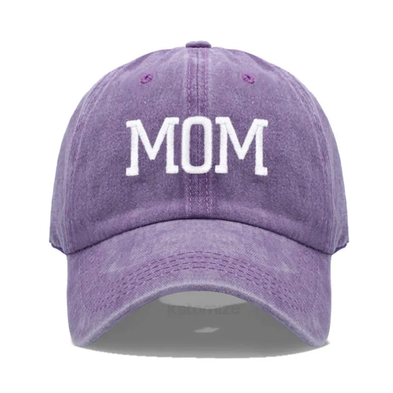 Adjustable purple cotton baseball cap with "MOM" embroidered in white.