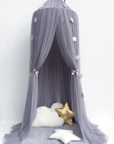Gray polyester canopy for baby crib with silver stars, creating a dreamy, protective space.