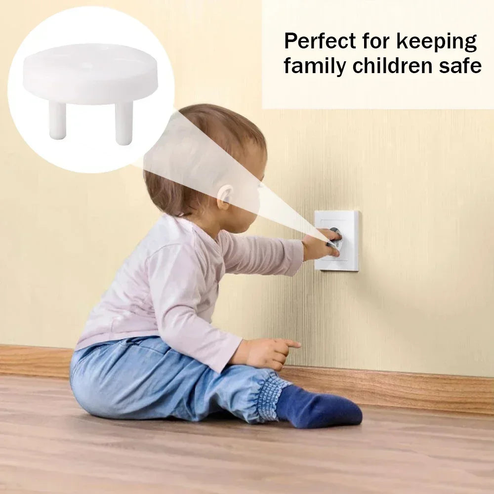 White child safety plug cover for French standard outlets, shown with a baby reaching for an outlet.