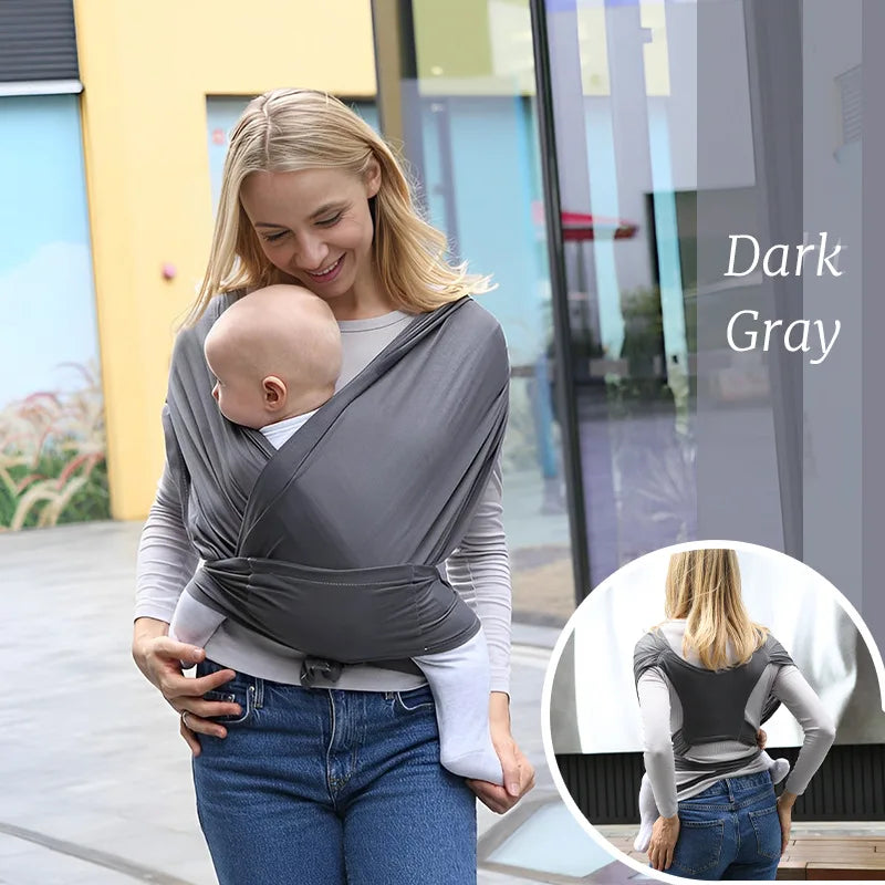 Smiling woman carrying baby in a dark gray ergonomic cotton baby wrap. Inset shows back view.