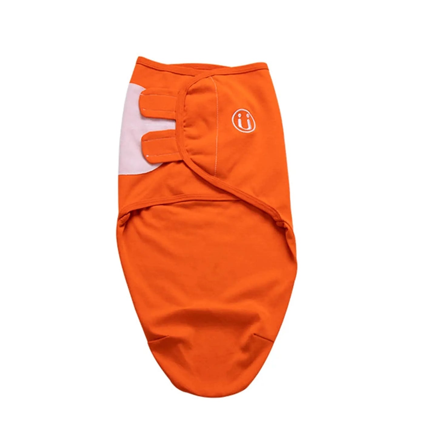 Orange cotton baby swaddle with white side panel and velcro closures, featuring a small smiley face logo.
