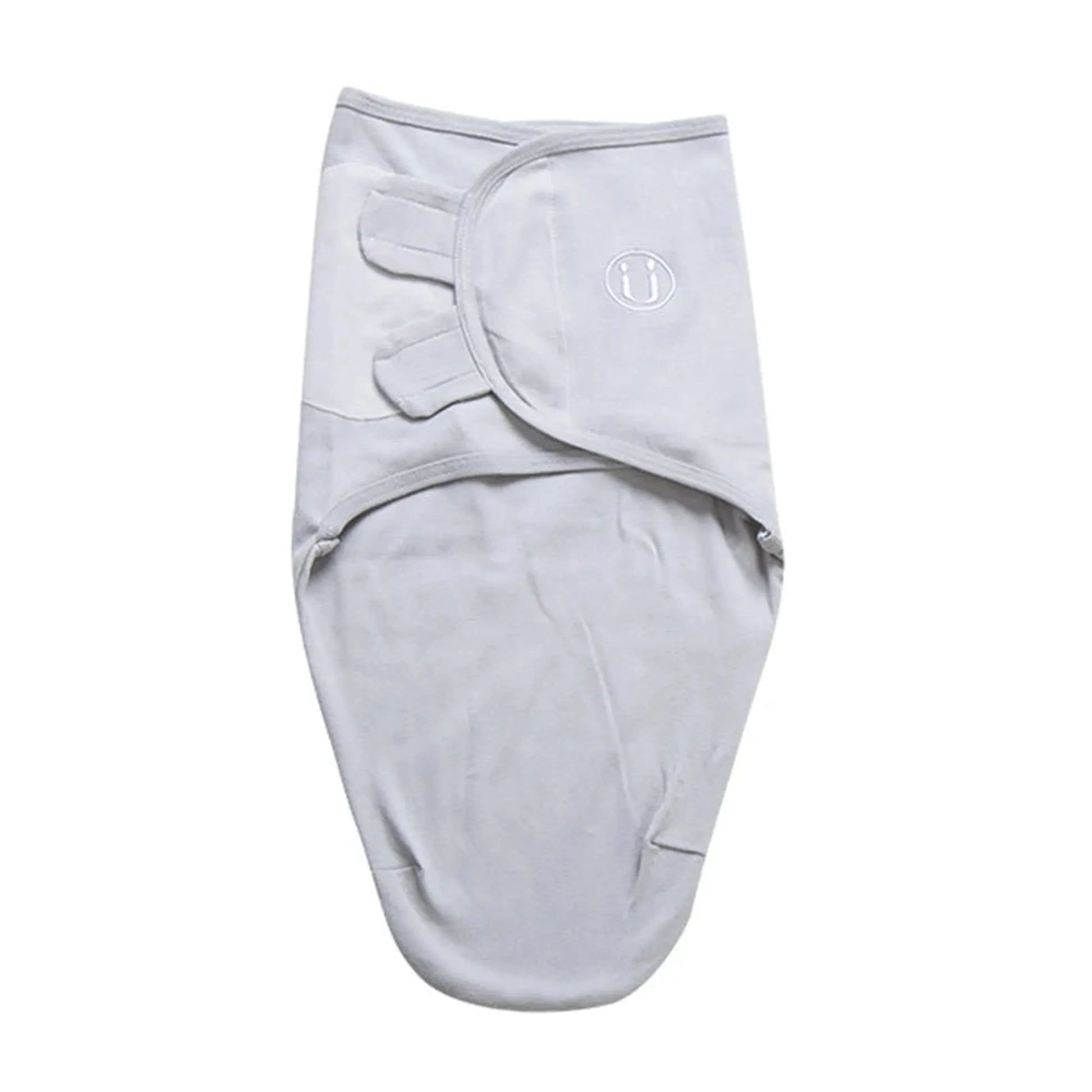 Light gray 100% cotton baby sleep sack swaddle with adjustable velcro wings and a small embroidered logo.