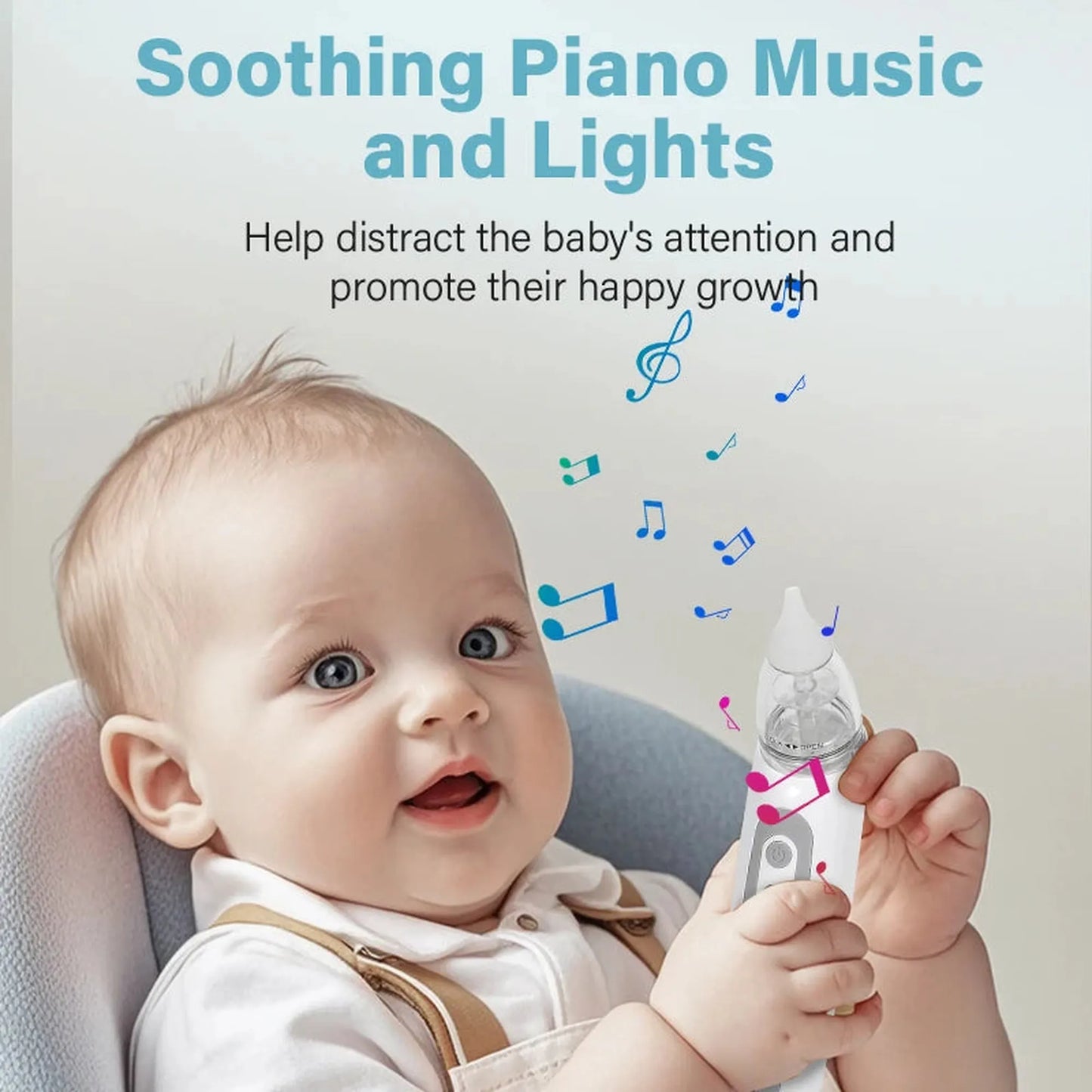 Happy baby holding a white electric nasal aspirator with a clear collection cup and soft silicone tip.