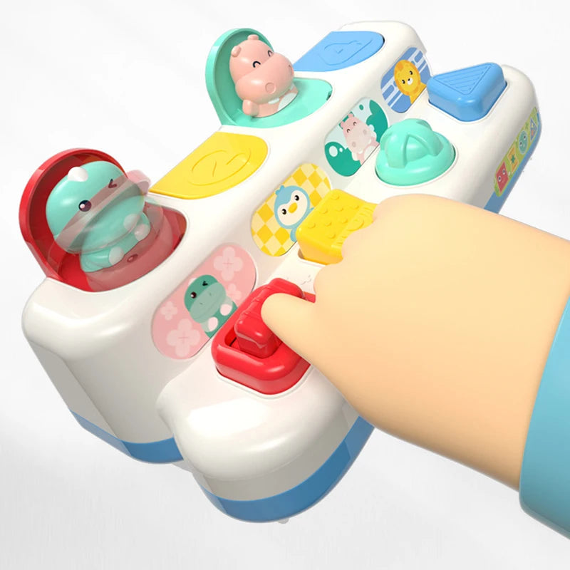 Child's hand pressing a red button on a colorful pop-up toy with animal figures, promoting motor skills.