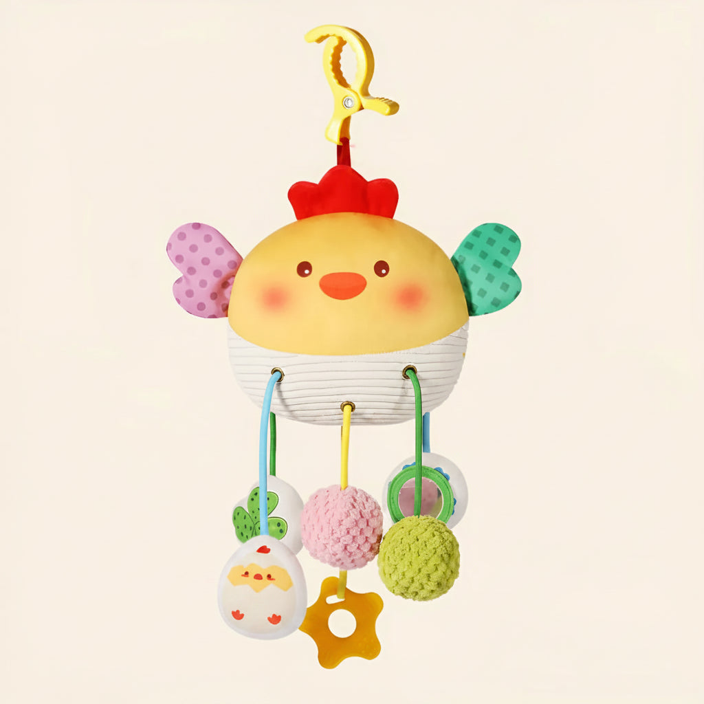 Soft yellow chicken crib toy with pull mechanism, rattle, mirror, and teether.