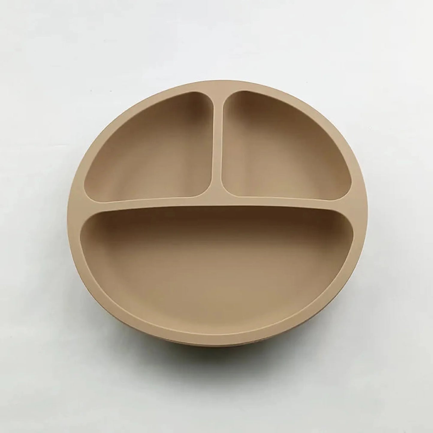 Tan silicone baby plate with three divided sections and a strong vacuum base.