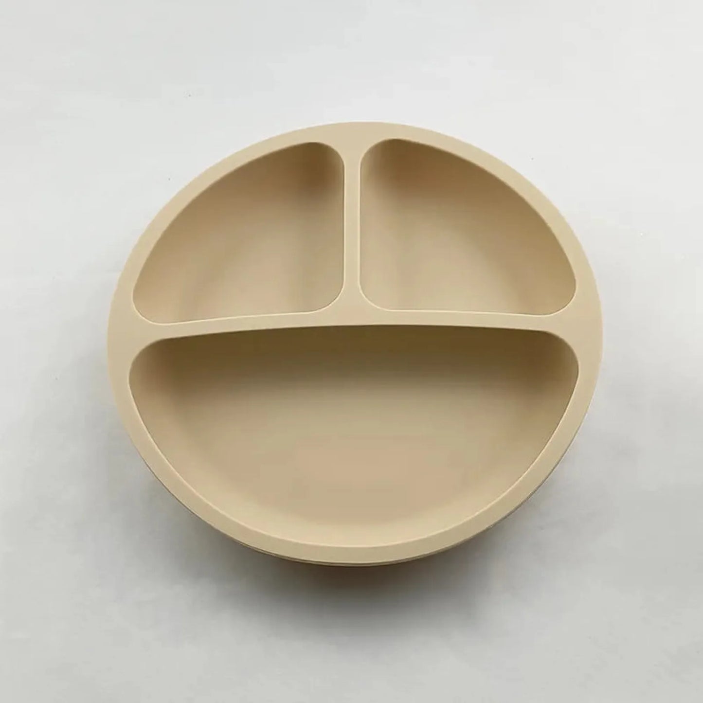 Beige silicone suction plate for babies with three divided sections.