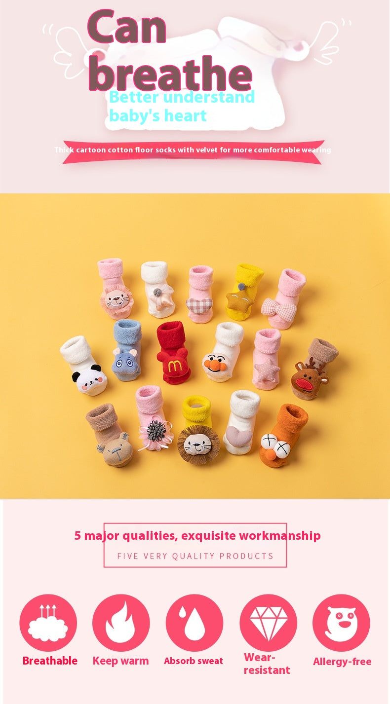 Assorted cartoon cotton baby socks with anti-slip soles, featuring various animal designs and colors.