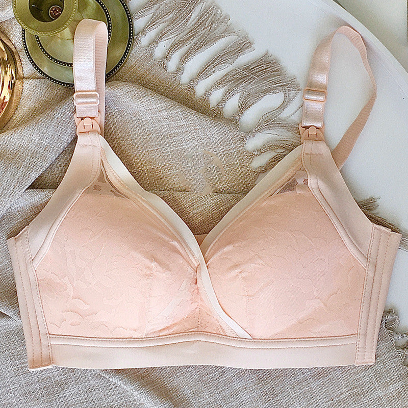 Seamless peach maternity nursing bra with delicate jacquard pattern and adjustable straps.