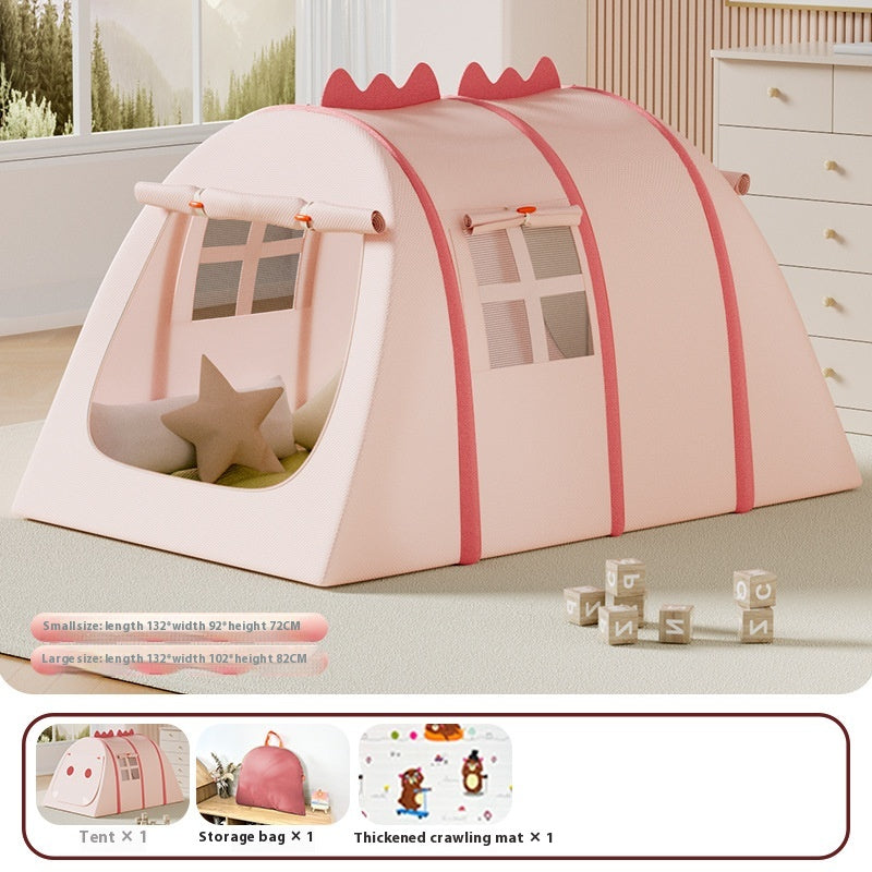 Pink fabric children's play tent with windows, dinosaur spikes, and a star pillow.