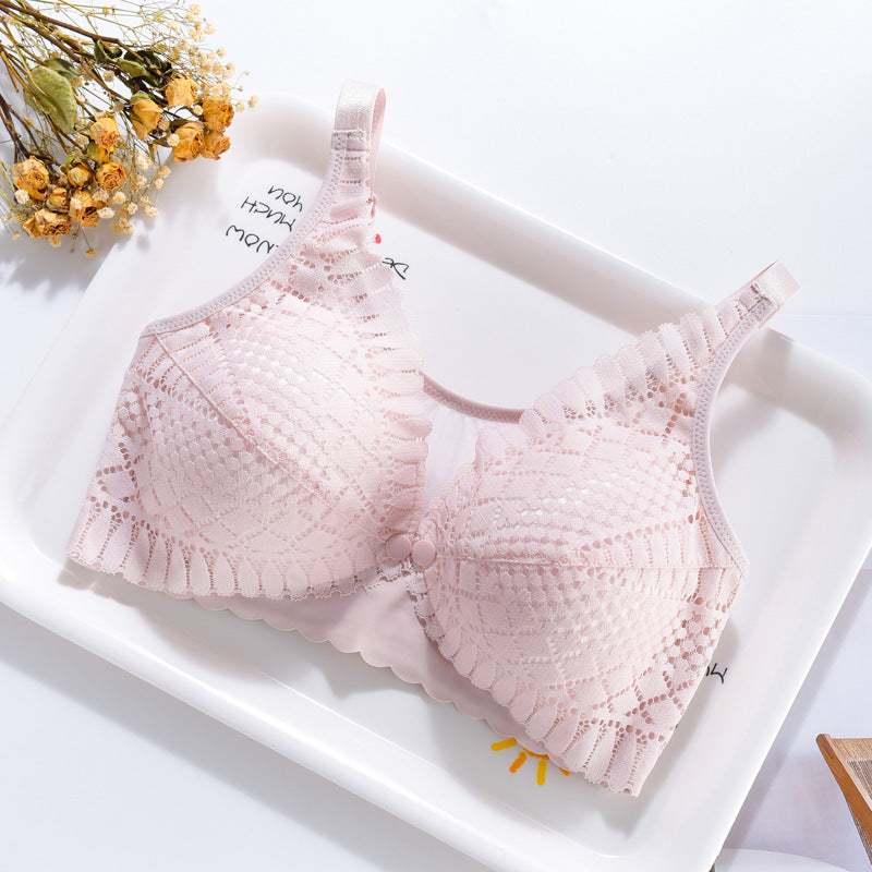Elegant light pink lace nursing bra with a convenient front closure, offering comfort and support.