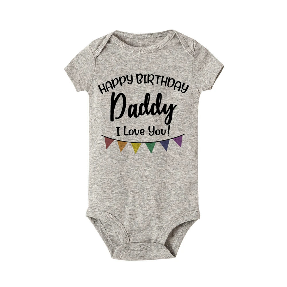 Gray baby bodysuit with "Happy Birthday Daddy I Love You!" text and colorful banner.