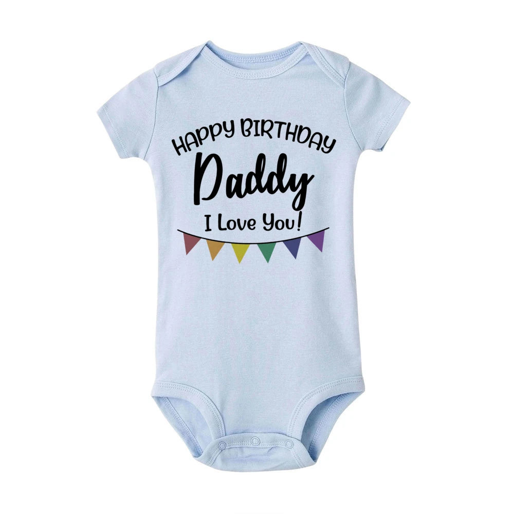 Light blue baby bodysuit with "Happy Birthday Daddy I Love You!" text and colorful banner.