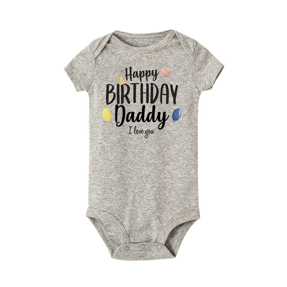 Gray baby bodysuit with "Happy Birthday Daddy I love you" text, party hat, and balloons.