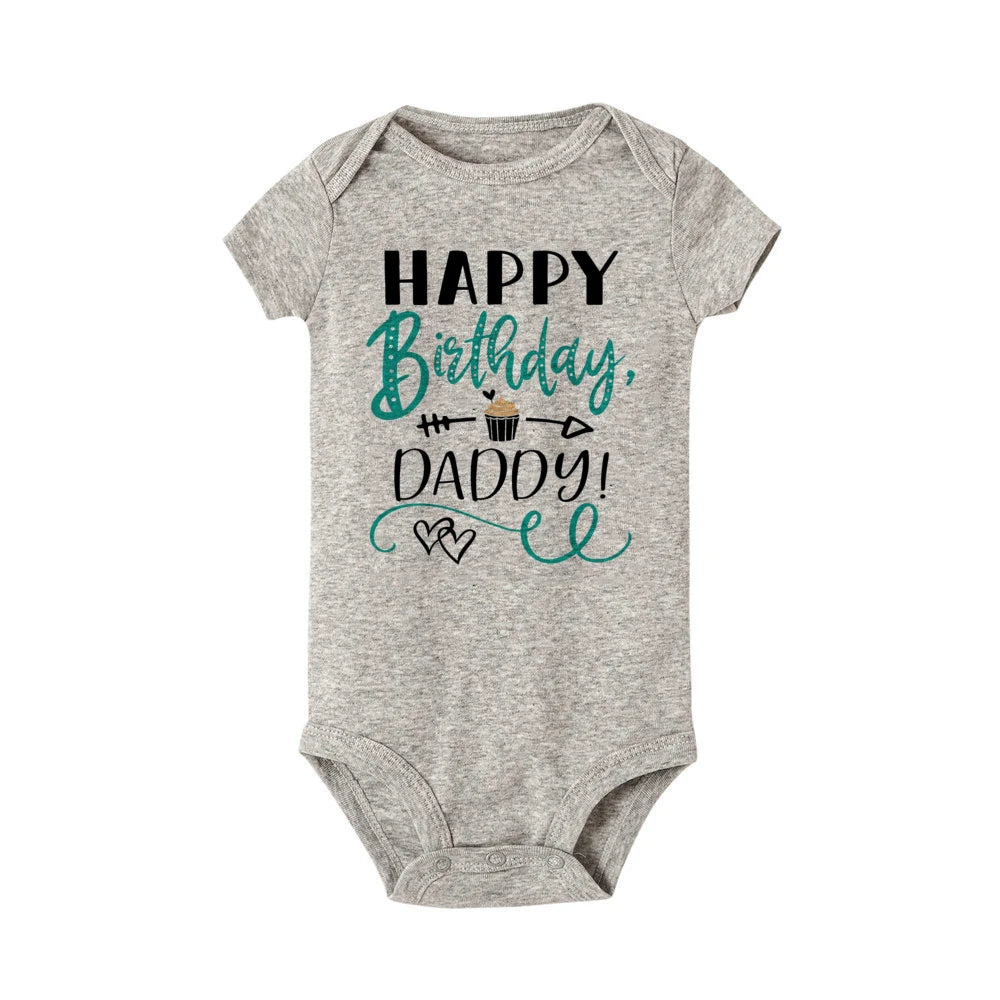 Gray baby bodysuit with "Happy Birthday, Daddy!" text and cupcake graphic.