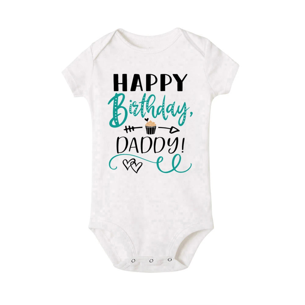 White short-sleeve baby bodysuit with "Happy Birthday, Daddy!" text and a cupcake graphic.