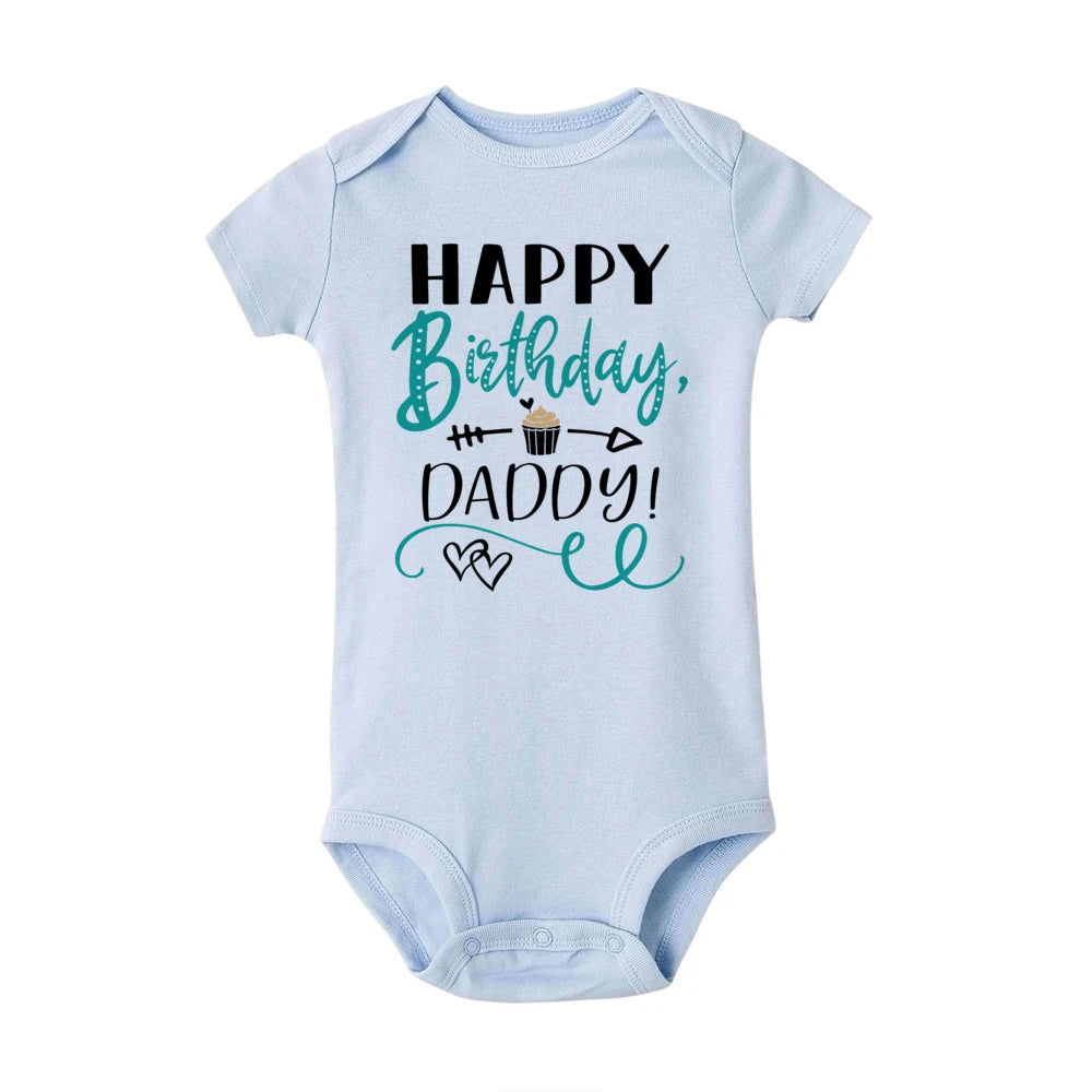 Light blue short-sleeve baby bodysuit with "Happy Birthday, Daddy!" text and a cupcake graphic.