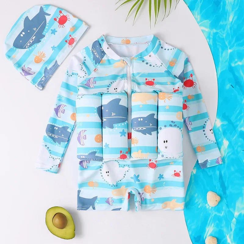 Kids' blue striped float swimsuit with shark and crab print, long sleeves, and matching swim cap.