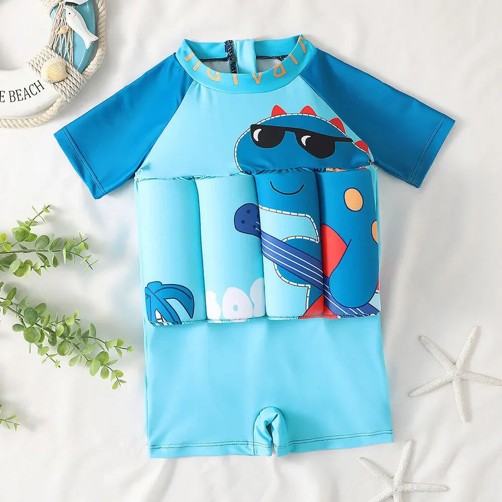 Blue kids' float swimsuit with short sleeves, a dinosaur cartoon print, and built-in buoyant sections.