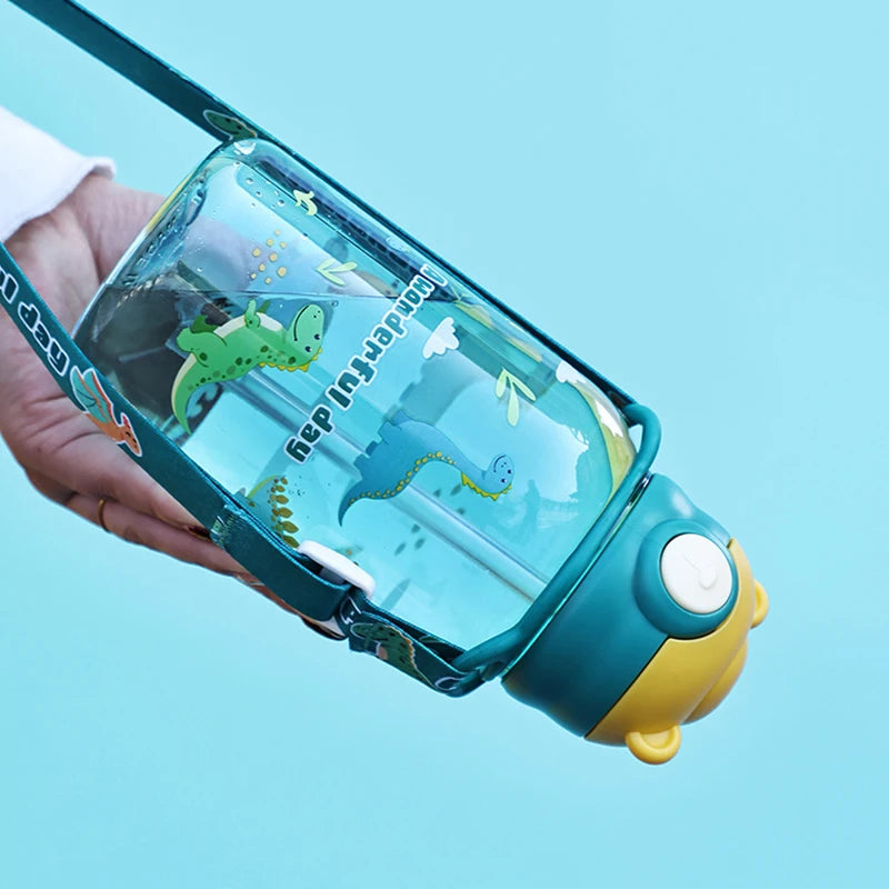 Blue 650ml kids' water bottle with dinosaur print, straw, handle, and teal strap.