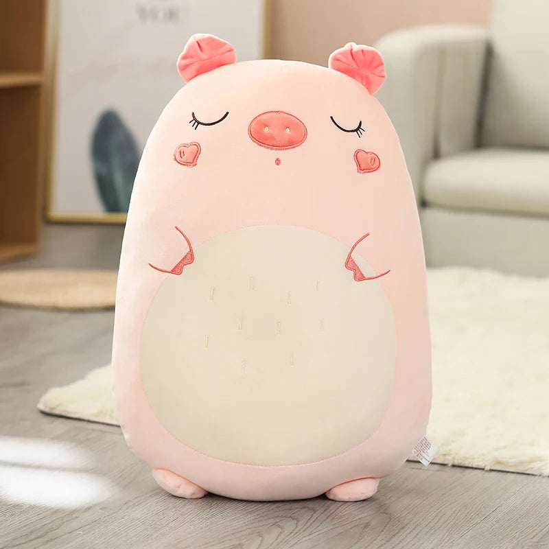 Soft pink plush pig animal pillow for kids, 45-80cm, with closed eyes and small ears.