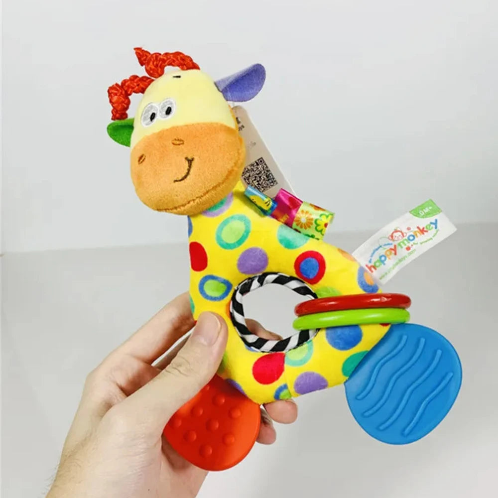 Colorful plush giraffe baby rattle and teether with red, green, and blue rings.