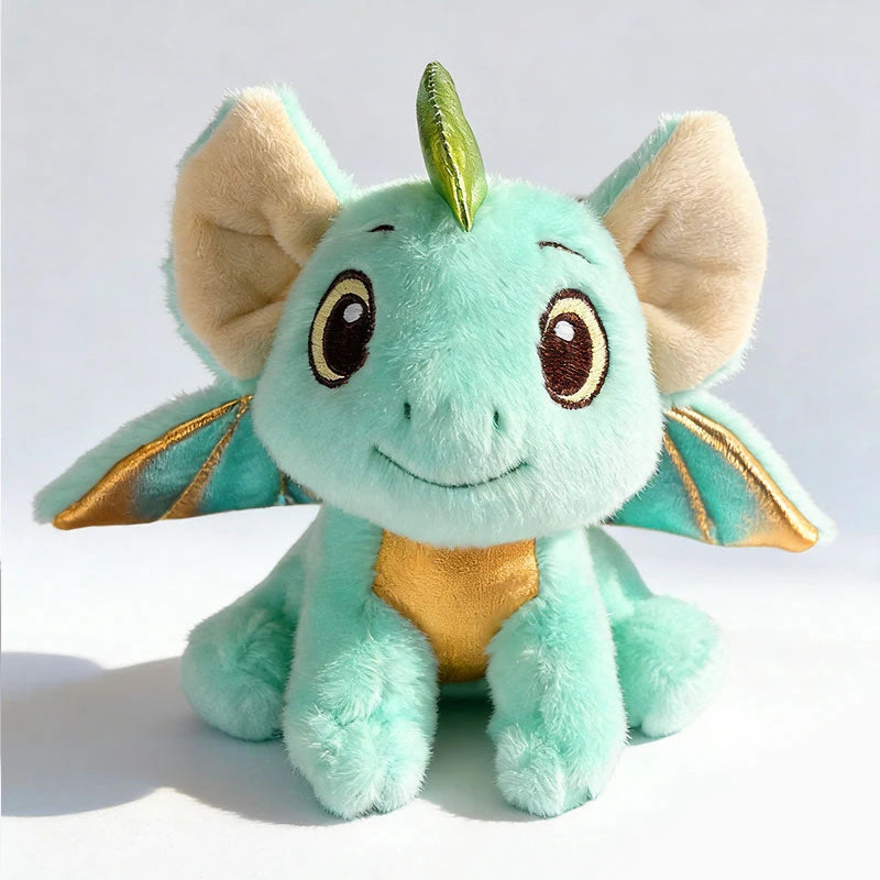 Cute mint green magnetic plush dragon with gold wings and belly, soft texture.