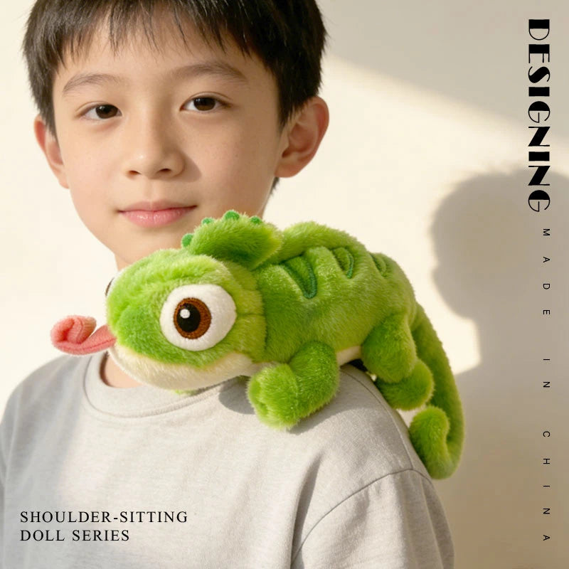 Child with a soft green chameleon shoulder plush toy, featuring big eyes and a pink tongue.