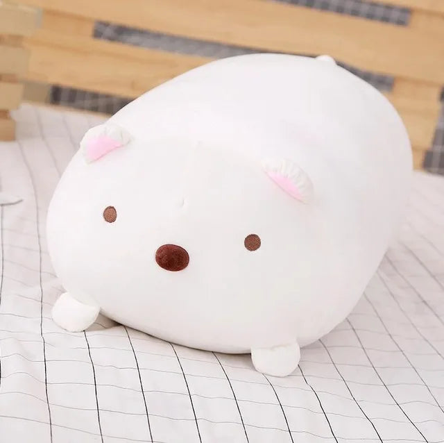 Soft white plush animal pillow with pink ears, brown eyes, and nose.