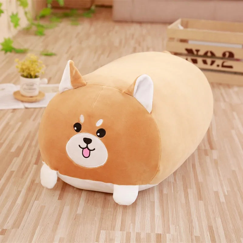 Soft brown plush Shiba Inu dog pillow with white ears and paws on a wooden floor.