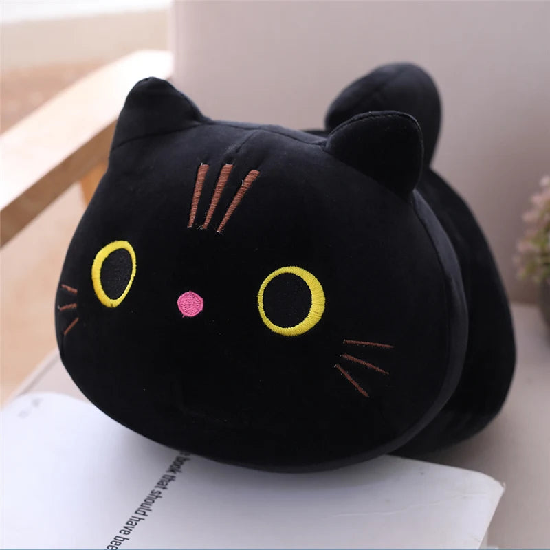 Soft black plush cat toy with yellow eyes and pink nose.