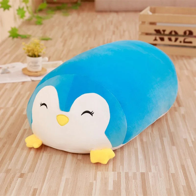 Soft blue penguin plush toy, a cuddly animal pillow for babies and toddlers.