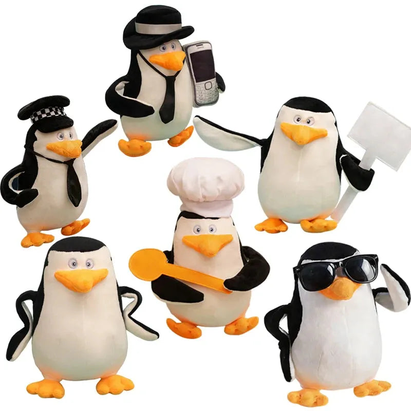 Six plush black and white Madagascar penguins, each 28cm, in various costumes like a chef, officer, and one with sunglasses.