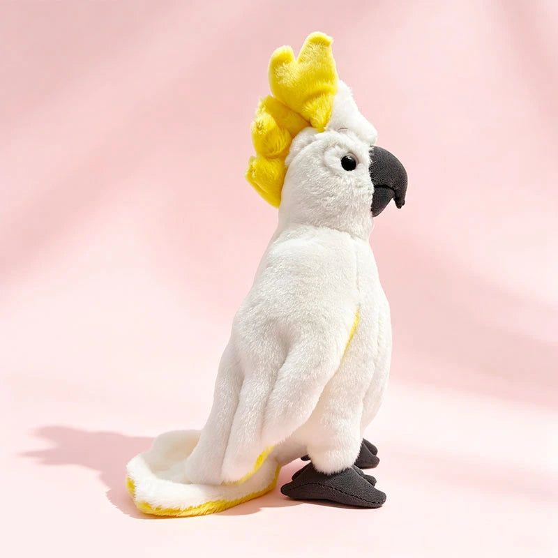 Soft, lifelike white cockatoo plush toy with yellow crest and tail accents, 22cm tall.